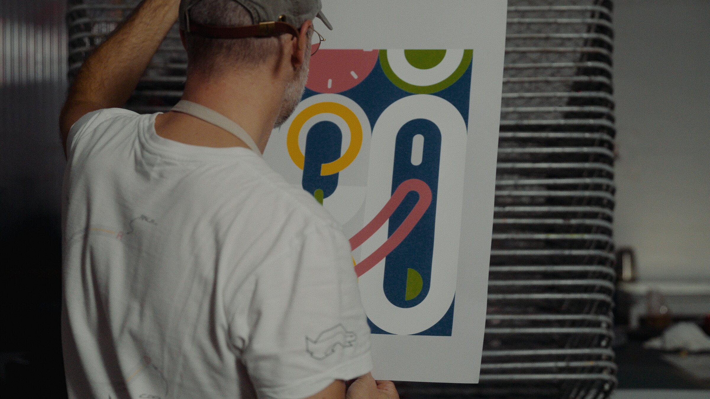 Artisan aligning a screen-printing frame