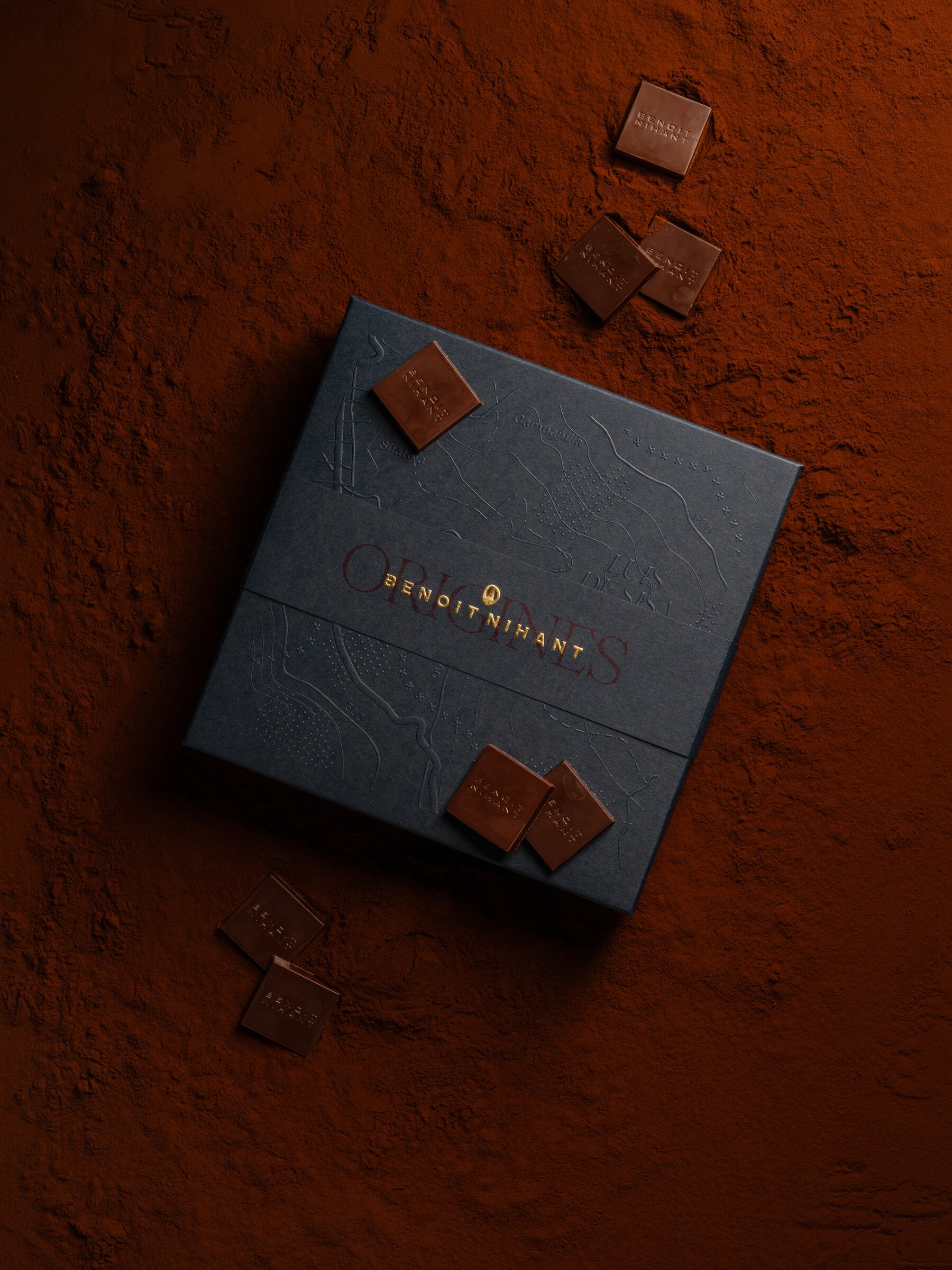 Benoît Nihant 'Origines' chocolate box on textured cocoa powder